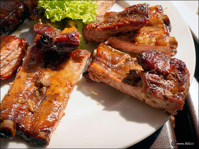 Jugosos Cortes de Chancho cocinado al Cilindro - Cevichela (Vitacura)